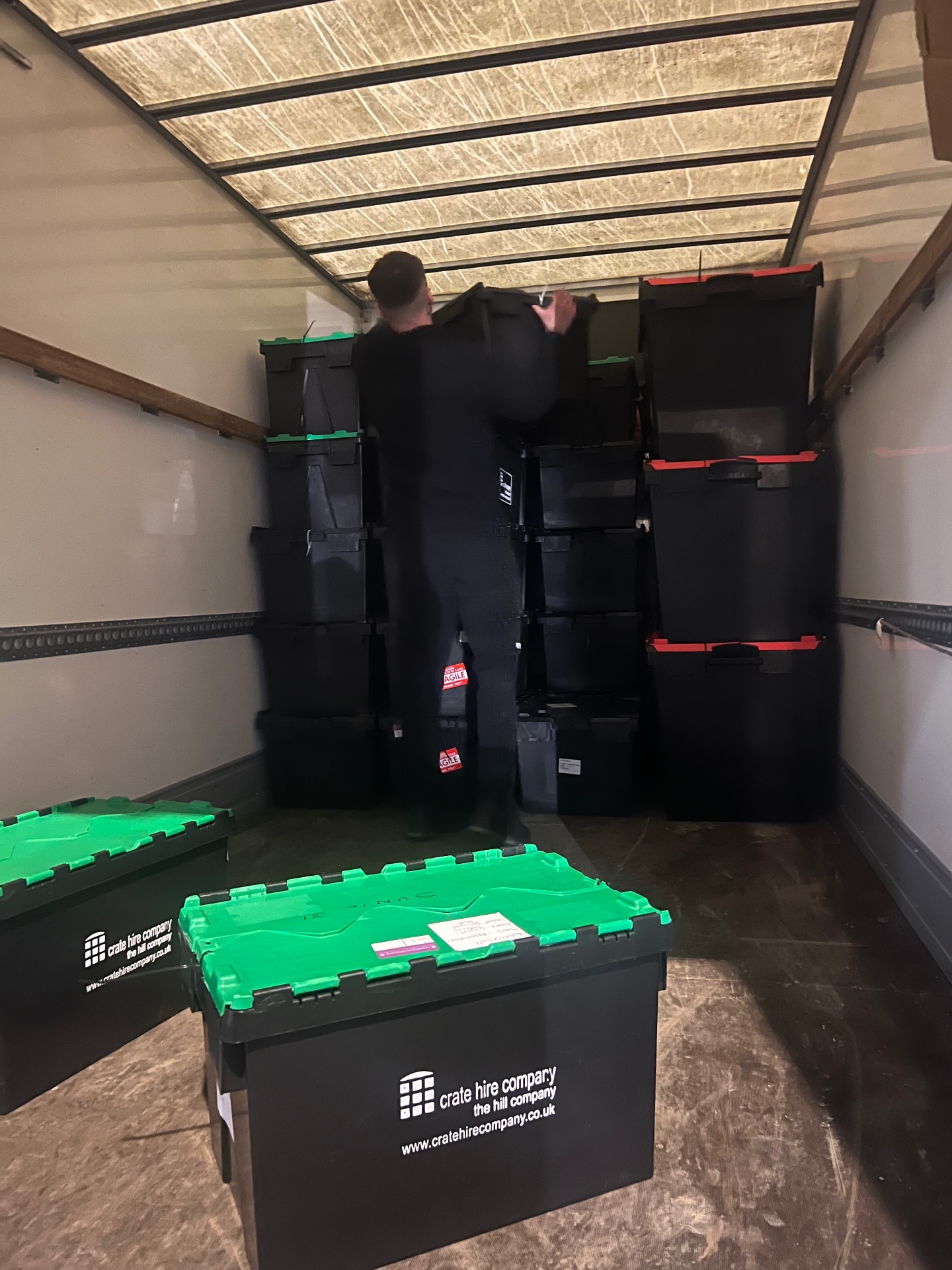 Professional crate hire boxes loaded inside a removal vehicle